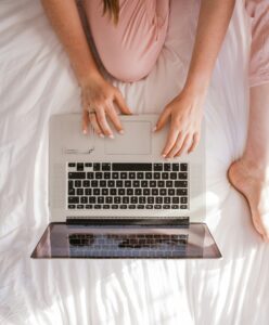 Woman engaging in Facebook stalking, also known as, internet Addiction on the computer.